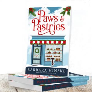 a stack of Paws & Pastries books on a white background